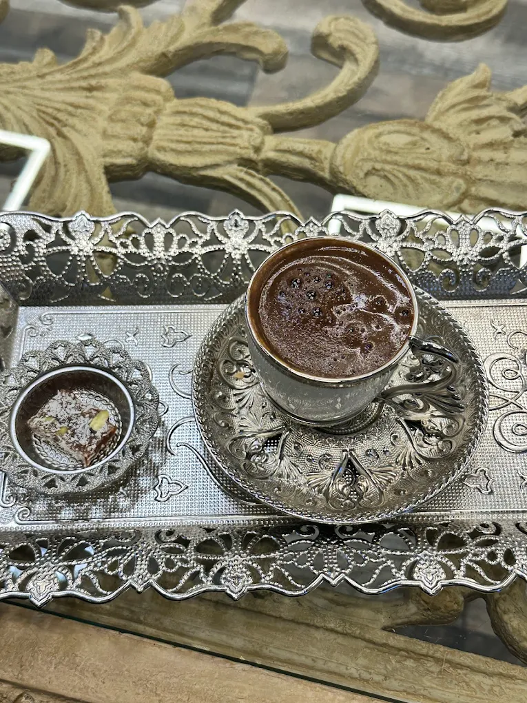 Turkish coffee served with lokum on an ornate tray